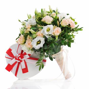 Bouquet for bride of roses, eustomy and pistachios with a wedding gift isolated on white background.
