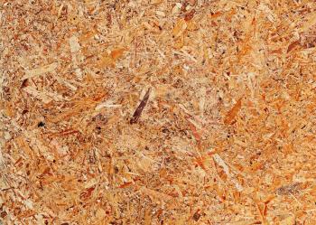 Recycled compressed wood chipboard.For designers for use as background. Closeup.