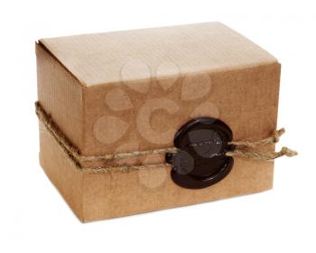 Brown cardboard box with stamp isolated on white background. Closeup. 