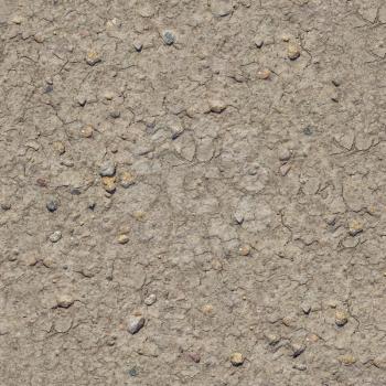 Cracked Brown Soil with Small Stones. Seamless Tileable Texture.