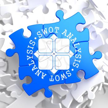 SWOT Analisis Written Arround Icon on Blue Puzzle. Business Concept.