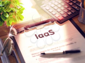 IaaS- Text on Paper Sheet on Clipboard and Stationery on Office Desk. 3d Rendering. Toned Image.