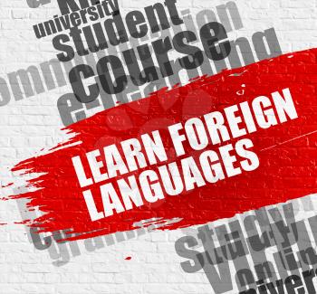 Business Education Concept: Learn Foreign Languages on the Red Brush Stroke. Learn Foreign Languages - on White Brickwall with Word Cloud Around. Modern Illustration. 