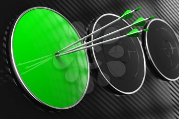 Blank Green Target for Your Concept - Three Arrows Hitting the Center of Green Target on Black Background.