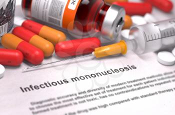 Infectious Mononucleosis - Printed Diagnosis with Blurred Text. On Background of Medicaments Composition - Red Pills, Injections and Syringe.