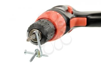 Cordless drill and screws isolated on a white background