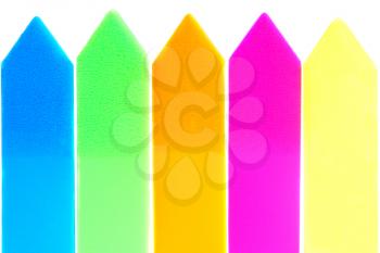 Colorful paper arrow highlighters isolated on white