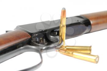 Macro shotof a Lever action rifle on white 