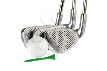 Three golf clubs, ball and tee isolated om white