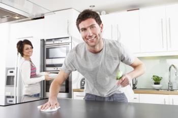 Young Couple Cleaning Cleaning Modern Kitchen