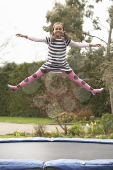Girl Playing On Trampoline