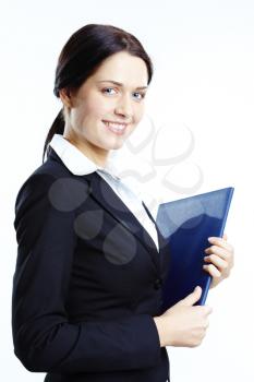 Portrait of elegant businesswoman with book in hand looking at camera