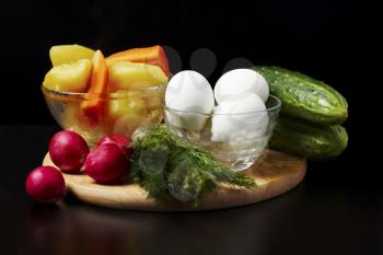 Image of several kinds of raw and boiled vegetables and eggs