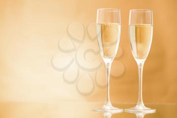 Horizontal image of two champagne standing on the table