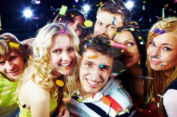 Photo of emotional teenagers laughing while having great party