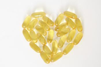 Fish oil capsules forming a shape of heart