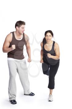 A woman running with her personal trainer
