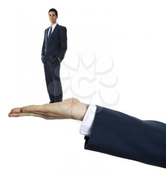 male hand palm up on white background holding businessman