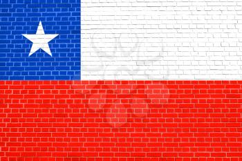 Flag of Chile on brick wall texture background. Chilean national flag.