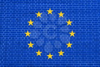 Flag of Europe on brick wall texture background. Flag of European Union.