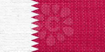 Flag of Qatar on brick wall texture background. Qatari national flag.