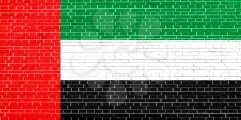 Flag of the United Arab Emirates on brick wall texture background. UAE national flag.
