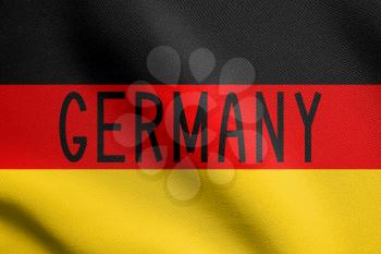 Flag of Germany waving in the wind with detailed fabric texture. German national flag. Word Germany.