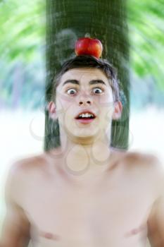 man with an apple on his head