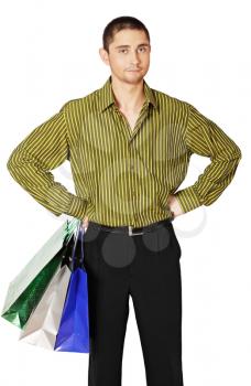 Young man with paper bags on white background