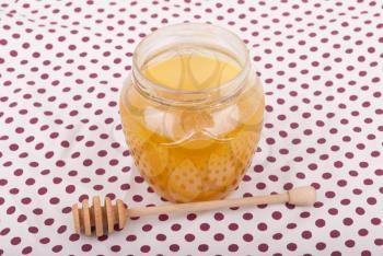 Royalty Free Photo of a Honey in a Glass Jar