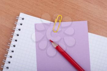 Royalty Free Photo of a Notebook, Pencil and Paper