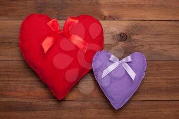 Two hearts on a wooden background. Gift for Valentine's Day.