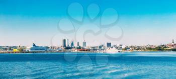 Panoramic Skyline Of Tallinn And Harbour, Coast With Blue Clear Sky At Sunrise, Estonia. View From Sea, Gulf Of Finland