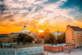 Cityscape And Helsinki Cathedral At Sunset With Dramatic Sky.
