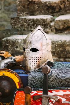 Protective helmet with a visor on medieval knight. Medieval Templar helmet waiting for knight