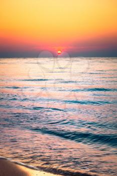 Soft Sea Ocean Waves Wash Over Golden Sand Background. Sunset, Sunrise, Sun