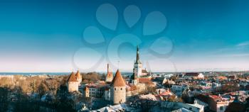 Tallinn, Estonia. Panoramic View Of Part Of Tallinn City Wall With Towers, At Top Of Photo There Is Tower Of Church Of St. Olaf Or Olav. Old Walls of Tallinn. Popular Place