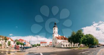 Nesvizh, Minsk Region, Belarus. Panoramic View Of Square And Town Hall In Summer Sunny Day. Famous Landmark In Nyasvizh. Architecture Of 16th Century.