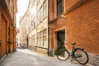 Parked Bicycle On Sidewalk In Old European Town. Bike Parking On Street, Stockholm, Sweden