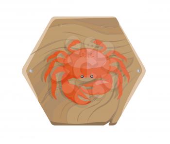 Fresh red sea crab with big claws and small black eyes on a wooden tray isolated on white background. Delicious seafood on salver.