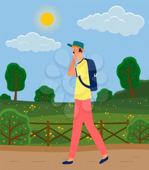 Young man walking and talking on mobile phone, male character communicating with smartphone. Person walking down street or park holding portable device in hand, guy has conversation by call
