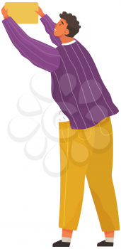 Young man stands and holds orange card on white background. Character wearing sweater and yellow pants. Programmer completes tasks, solves cases and works. Vector illustration of busy person