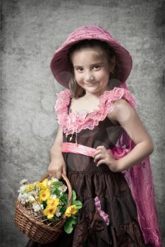photo in retro style, the little girl with a basket flowers