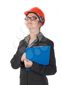 woman in the construction helmet and a tablet in the hands of watches building area