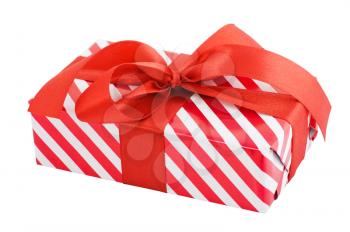 Gift box wrapped in striped paper and a bow. Object with Clipping Paths