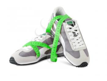 sports shoes for running with a roulette isolated on the white