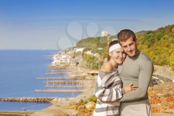 young couple on the background of beautiful scenery