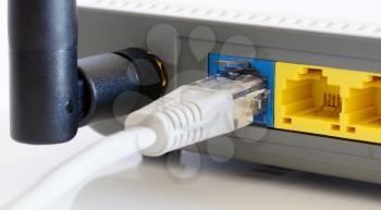 Closeup of network cable connected to wifi router