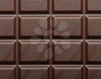 dark chocolate bar as background closeup