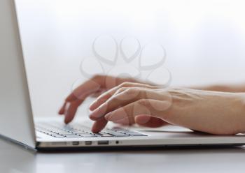 Close up of typing female hands on keyboard